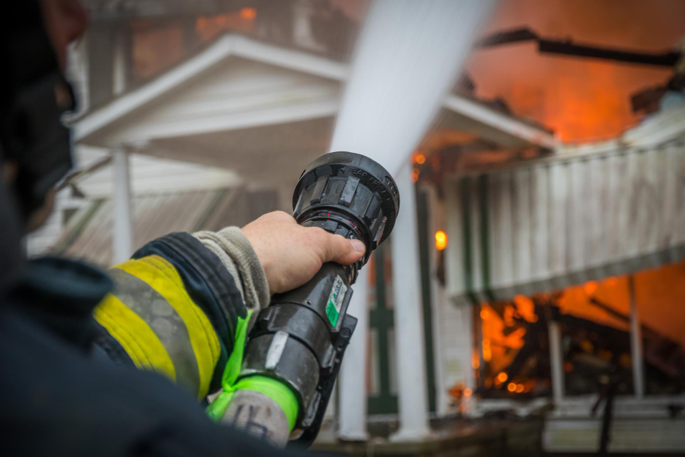 A property inspector checking building damage (fire, flood, storm).