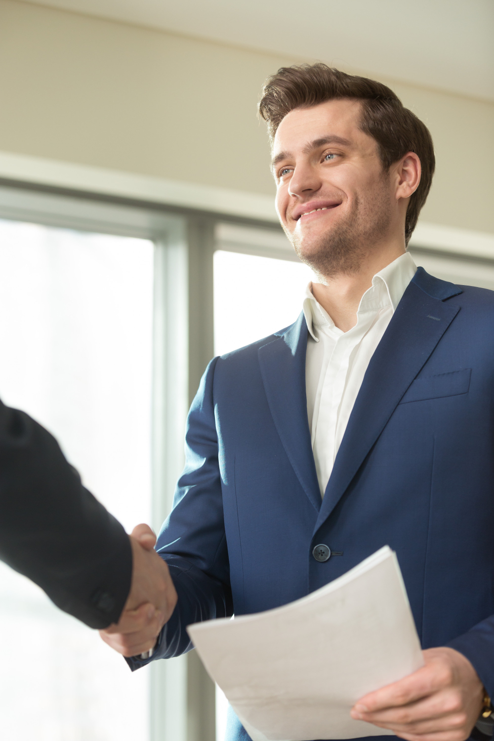 A person looking relieved or happy after discussing finances.
